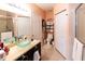 Clean bathroom with glass sink and walk-in shower at 3653 Kings Rd # 101, Palm Harbor, FL 34685