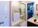 Walk-in shower with grab bars and bench seating at 3653 Kings Rd # 101, Palm Harbor, FL 34685