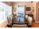 Bright dining room featuring a large marble table and six chairs at 3653 Kings Rd # 101, Palm Harbor, FL 34685