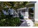 Well-lit front entrance with visible door and small sitting area at 3653 Kings Rd # 101, Palm Harbor, FL 34685
