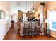 Kitchen with breakfast bar and three barstools, open to dining area at 3653 Kings Rd # 101, Palm Harbor, FL 34685