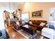 Open living room with hardwood floors and a view of the kitchen at 3653 Kings Rd # 101, Palm Harbor, FL 34685