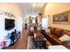 Spacious living room with leather sofas and wood floors at 3653 Kings Rd # 101, Palm Harbor, FL 34685