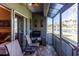 Screened patio with canal view and outdoor grill at 3653 Kings Rd # 101, Palm Harbor, FL 34685