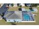 Community pool and shuffleboard from above at 37347 Derbyshire Dr, Zephyrhills, FL 33542