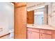 Bathroom with pink vanity, toilet and shower at 37347 Derbyshire Dr, Zephyrhills, FL 33542