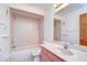 Updated bathroom with a bathtub and sink at 37347 Derbyshire Dr, Zephyrhills, FL 33542