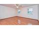 Bright bedroom featuring hardwood floors and ceiling fan at 37347 Derbyshire Dr, Zephyrhills, FL 33542