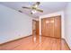 Spacious bedroom with hardwood floors and ceiling fan at 37347 Derbyshire Dr, Zephyrhills, FL 33542