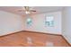 Bright bedroom featuring hardwood floors and ceiling fan at 37347 Derbyshire Dr, Zephyrhills, FL 33542