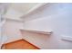 Walk-in closet with ample shelving and hanging space at 37347 Derbyshire Dr, Zephyrhills, FL 33542
