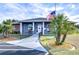 Community clubhouse with accessible ramp and flag at 37347 Derbyshire Dr, Zephyrhills, FL 33542