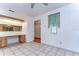 Bright dining area with wood flooring and view into kitchen at 37347 Derbyshire Dr, Zephyrhills, FL 33542
