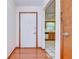 Bright entryway with hardwood floors and a view into the kitchen at 37347 Derbyshire Dr, Zephyrhills, FL 33542
