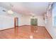 Living room with hardwood floors and sliding glass doors at 37347 Derbyshire Dr, Zephyrhills, FL 33542