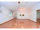 Living room with hardwood floors and access to other rooms at 37347 Derbyshire Dr, Zephyrhills, FL 33542