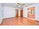 Main bedroom with hardwood floors and en-suite bathroom at 37347 Derbyshire Dr, Zephyrhills, FL 33542