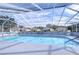 Enjoy this refreshing community pool with a screened enclosure at 37347 Derbyshire Dr, Zephyrhills, FL 33542