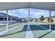 Enjoy a game of shuffleboard under covered courts at 37347 Derbyshire Dr, Zephyrhills, FL 33542