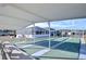 Community shuffleboard courts with covered seating at 37347 Derbyshire Dr, Zephyrhills, FL 33542