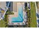 Community pool and patio viewed from above at 4062 Cadence Loop, Land O Lakes, FL 34638