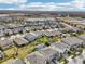 Aerial view of houses and community at 4062 Cadence Loop, Land O Lakes, FL 34638