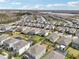 Aerial view of houses and community at 4062 Cadence Loop, Land O Lakes, FL 34638