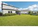 Large backyard with grassy lawn and home view at 4062 Cadence Loop, Land O Lakes, FL 34638