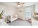 Charming Bedroom with crib, window, and neutral decor at 4062 Cadence Loop, Land O Lakes, FL 34638