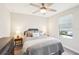 Spacious bedroom with a queen-size bed and ample natural light at 4062 Cadence Loop, Land O Lakes, FL 34638