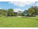 Community clubhouse with covered pavilion and open green space at 4062 Cadence Loop, Land O Lakes, FL 34638