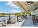 Covered community deck with lake view and seating at 4062 Cadence Loop, Land O Lakes, FL 34638