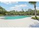 Resort-style pool with lounge chairs and patio area at 4062 Cadence Loop, Land O Lakes, FL 34638