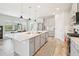 Spacious kitchen with island, stainless steel appliances, and gray cabinets at 4062 Cadence Loop, Land O Lakes, FL 34638