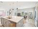 Modern kitchen features a large island, stainless steel appliances, and gray cabinets at 4062 Cadence Loop, Land O Lakes, FL 34638