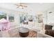 Open concept living room and kitchen with a large sectional sofa and rug at 4062 Cadence Loop, Land O Lakes, FL 34638