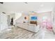 Spacious living room with light flooring and a large sectional sofa at 4062 Cadence Loop, Land O Lakes, FL 34638
