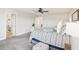 Main bedroom with king bed, view of en-suite bathroom at 4062 Cadence Loop, Land O Lakes, FL 34638
