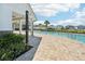 Community pool with a shower and lounge area at 4062 Cadence Loop, Land O Lakes, FL 34638