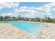 Community pool with plenty of lounge chairs at 4062 Cadence Loop, Land O Lakes, FL 34638