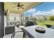 Relaxing screened patio with seating and outdoor grill at 4062 Cadence Loop, Land O Lakes, FL 34638