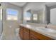 Clean bathroom with tub, toilet and wood vanity at 5708 Bayshore Dr, Seminole, FL 33772
