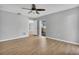 Bright bedroom with laminate flooring and door to patio at 5708 Bayshore Dr, Seminole, FL 33772