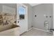 Laundry room with a utility sink and exterior access at 5708 Bayshore Dr, Seminole, FL 33772
