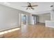 Spacious living area with laminate floors and access to a patio at 5708 Bayshore Dr, Seminole, FL 33772