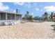 Large pool area with brick pavers and surrounding homes at 5708 Bayshore Dr, Seminole, FL 33772