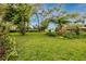 Green backyard with lush landscaping at 6226 Hampton N Ct, St Petersburg, FL 33710