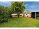Large backyard with shed and grassy area at 6226 Hampton N Ct, St Petersburg, FL 33710