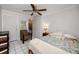 Comfortable bedroom with ceiling fan and built-in shelving at 6226 Hampton N Ct, St Petersburg, FL 33710