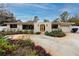 Ranch style home with mature landscaping and a circular driveway at 6226 Hampton N Ct, St Petersburg, FL 33710